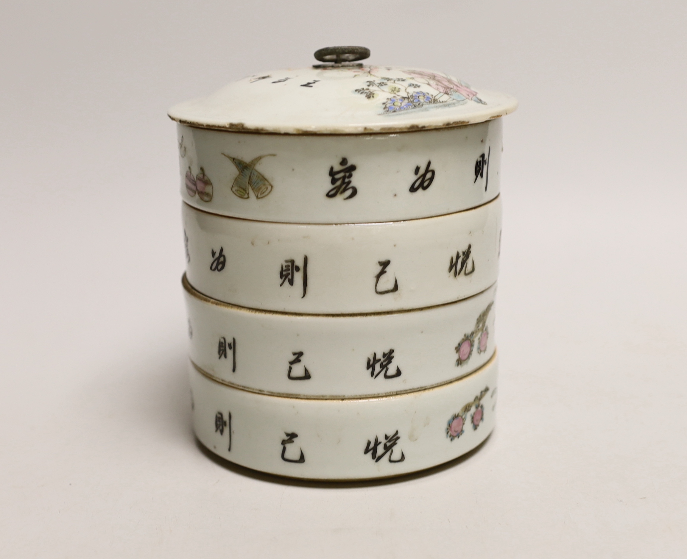 An early 20th century Chinese four section food container hand painted in the famille rose palette, 14cm high